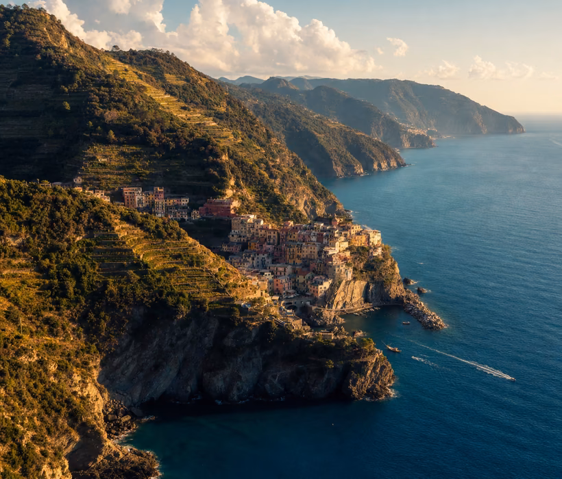 Aerial view of Amalfi Coast cliffs and turquoise water.