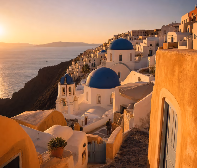Sunset view over Oia village and caldera cliffs.