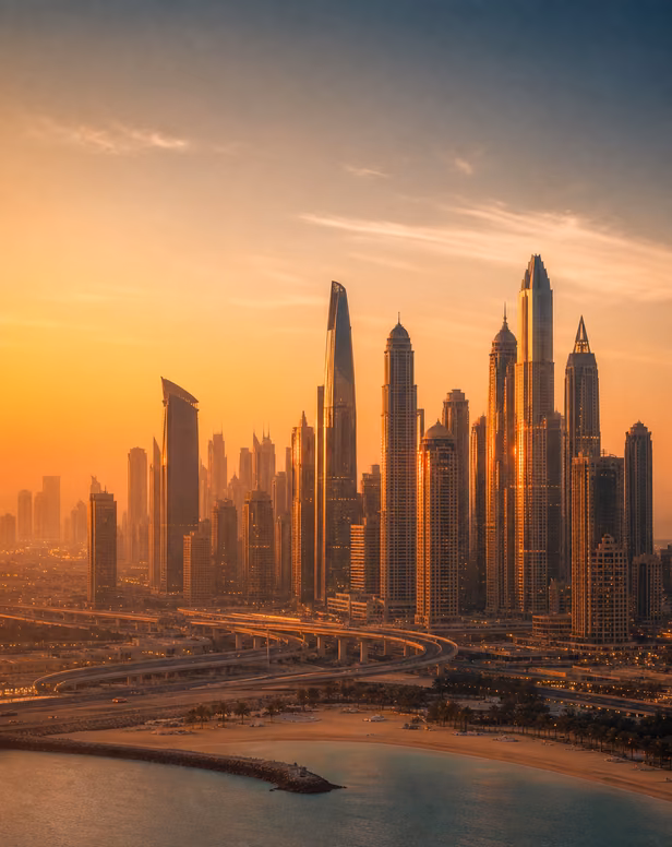 Dubai skyline with luxury skyscrapers at sunset.