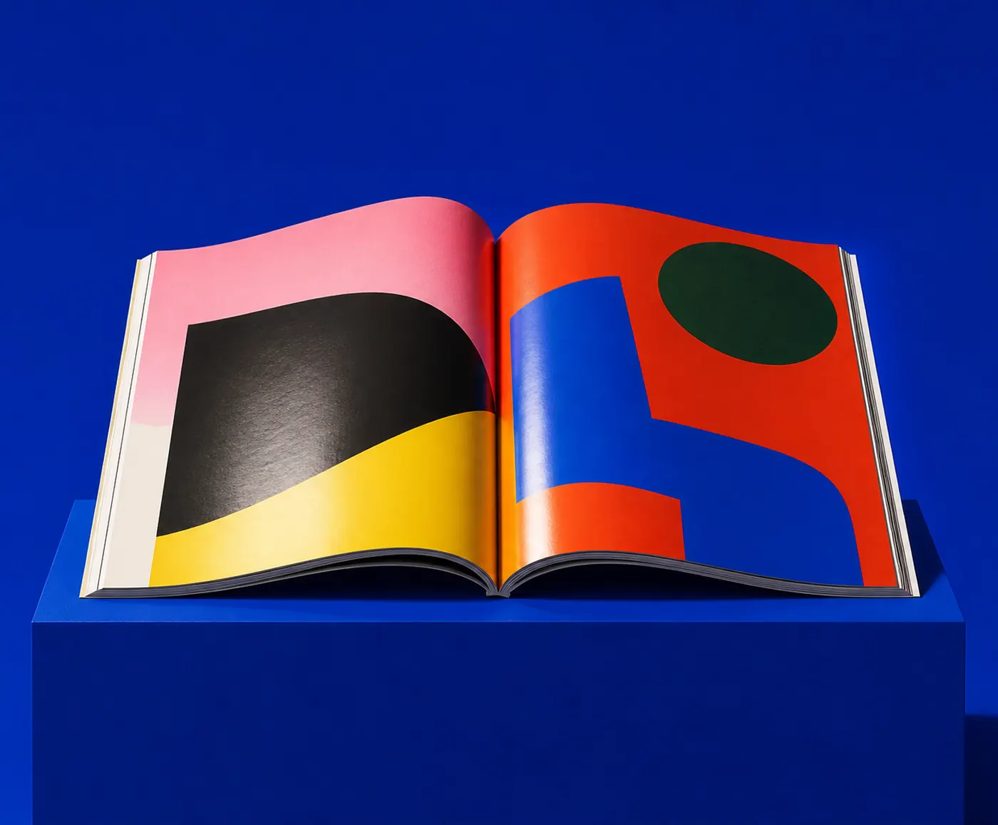 Loud Order cover: a glossy magazine open on a plinth against cobalt