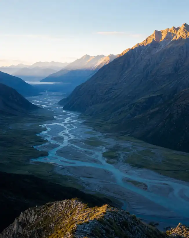Wide valley seen from a ridge at first light