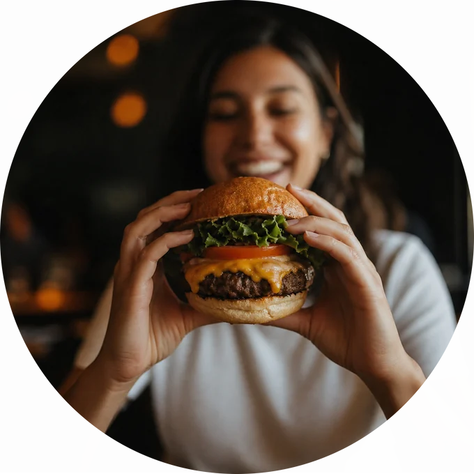 A burger held in both hands