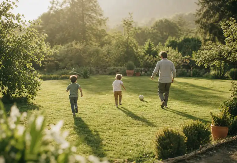 Children playing ball on a well-kept lawn